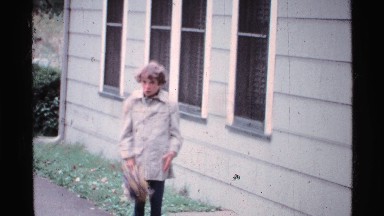 1969: a boy is standing near the house OHIO