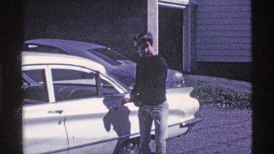 1969: a man opened the door at the backside of the car and the outside