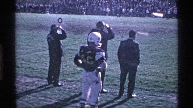 1969: group of men watching a football game from the sidelines OHIO
