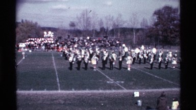 1969: football players are standing on the field waiting for a game to start