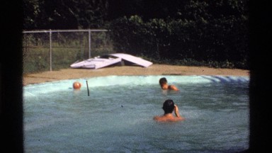 1978: two men in a pool playing with a ball. CALIFORNIA