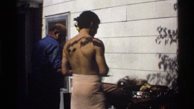 1978: backyard grilling, one guy shows off in a towel CALIFORNIA