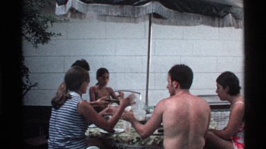 1978: people eating outside at a picnic table. CALIFORNIA