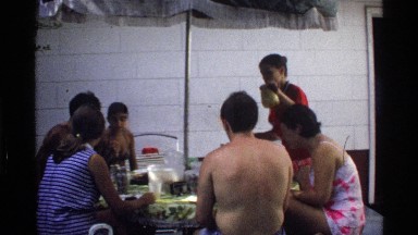 1978: people having lunch in an open outdoor dining table in backyard of their