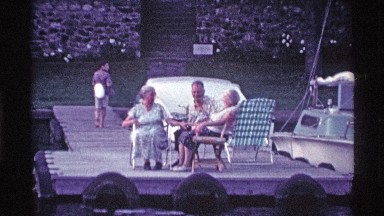 1969: Elderly People Sitting in Lawn Chairs Near the Docks