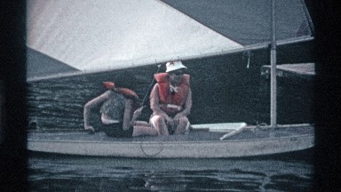 1969: a couple sailing together outside on a body of water
