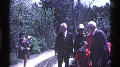 1969: a small girl take a photo our big family stop to garden center