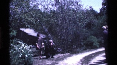 1969: a lady is do some action the man is take the photo