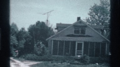 1969: a house that located alone and some trees are surrounding at the place
