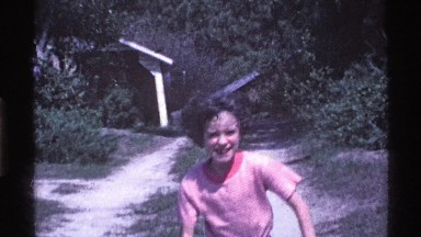 1969: a girl playing in garden around the house OHIO