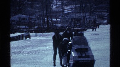 1969: snow sliding and enjoying with family in a winter season with their pet