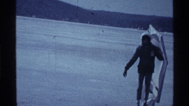 1969: person skating slowly across the icy lake in winter OHIO
