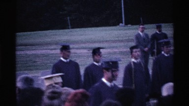 1969: young people and their family at high school graduation ceremony OHIO