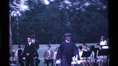 1969: a college convocation program a young collect go the stage in our finish