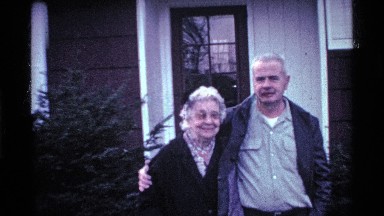 1969: a old couple smiling for a photograph and their grand daughter