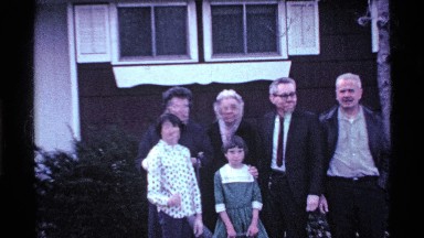 1969: a big family take the video near the our green house very happy