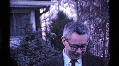 1969: a family stands in a yard posing for photos on a winter day OHIO