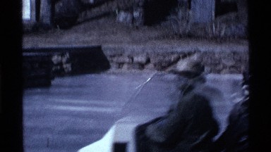 1969: people seated, leaning on, long vehicle, crossing through icy region. OHIO