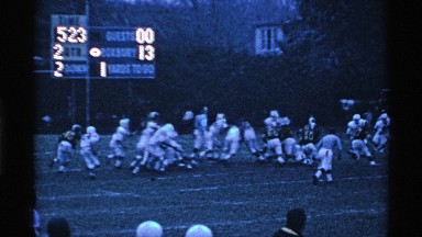 1969: fast run for the football match player run the ground follow the ball OHIO