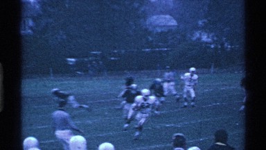 1969: a football game between a team in white and a team in green