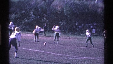 1969: the soccer players playing in the ground,run for a goal,a thrilling