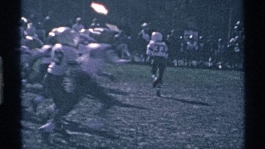 1969: young football players run, fall and scramble on field over white line