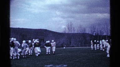 1969: a group of players were playing on the ground a man hits the ball OHIO