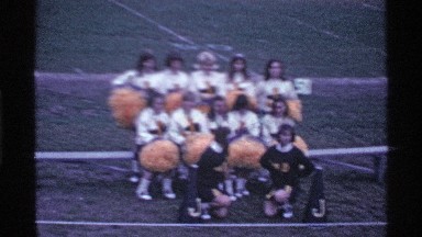 1969: a big ground players run the green grasses ground woman watch the sitting