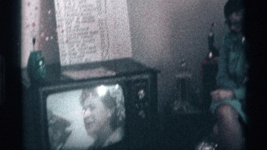 1976: Family Members Gather at Home Watching Television