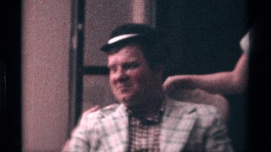 1976: two people talking each other while one of them is wearing a jacket