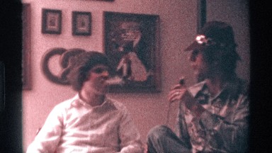 1976: a man in a hat interviews another man smoking a cigar. KENTUCKY
