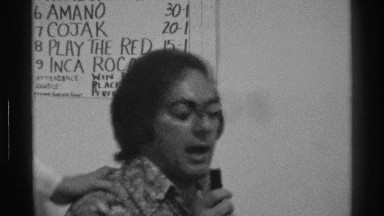 1976: an indoor game show two people are talking over microphone and showing