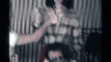 1976: person with microphone polling people in family gathering KENTUCKY