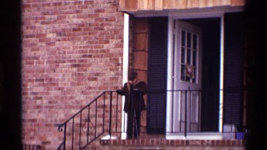 1970: a boy stand at the way and two ladies are talking each other