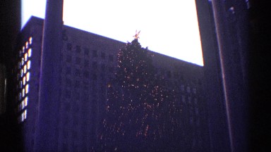 1970: a christmas tree with full of lighting and it looks so beautiful a
