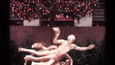 1970: the big building to near statue fling back side big christmas tree set