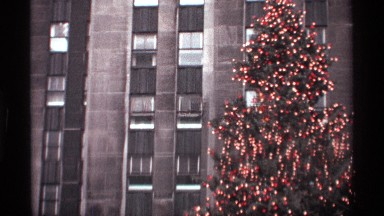 1970: the big building to near statue fling back side big christmas tree set