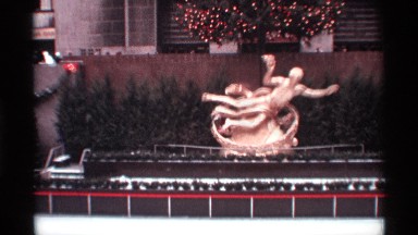 1970: The Big Building Near Statue with Christmas Tree Set on Side