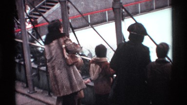 1970: a women watch the some place not clear the image near to steps in up place