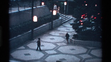 1971: the small children walk the big hall near to the christmas tree wall