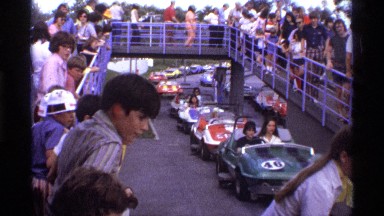 1974: cute view of go cart race where kids are enjoying their holiday in a park