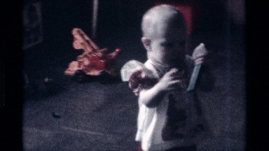 1976: caucasian baby being filmed while playing with a microphone KENTUCKY