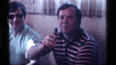 1976: two men are sitting next to each other and one of them are talking