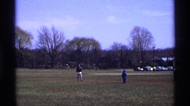 1969: Man and Two Kids Playing with Ball in Michigan