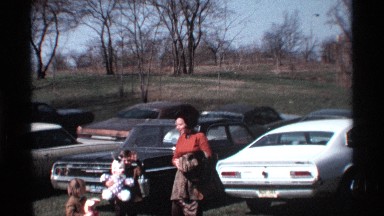 1969: two children and their mother in the parking lot MICHIGAN