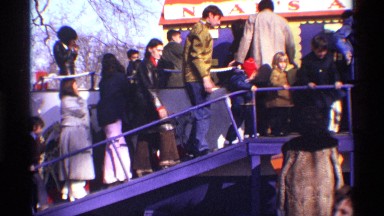 1969: People and Children Going to Vehicle Step by Step