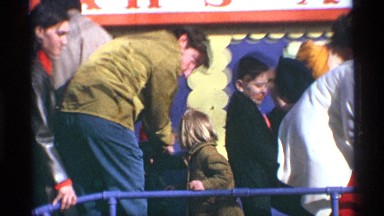 1969: people are on a small bridge in a recreational spot with kids NEW YORK