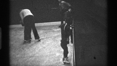 1971: the small boy training for skating near another little boy train