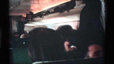 1971: passengers getting seated down in a commercial airliner awaiting liftoff.