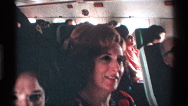 1971: two children and two women are enjoying flight journey by singing NEW YORK